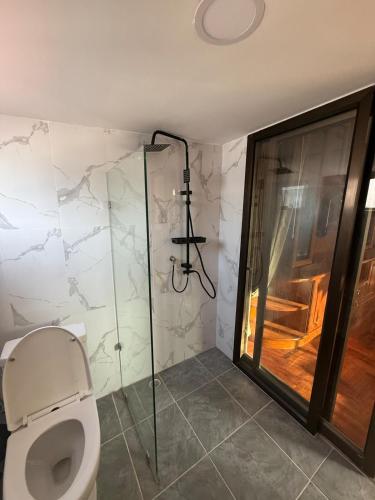 a bathroom with a toilet and a shower at 5BR Private Pool in Jomtien Beach