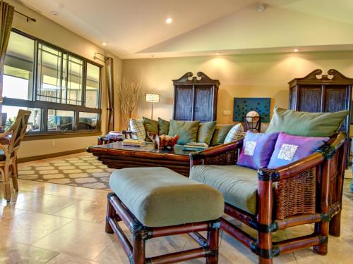 a living room with a couch and a chair at Mahana House Country Inn in North Hilo