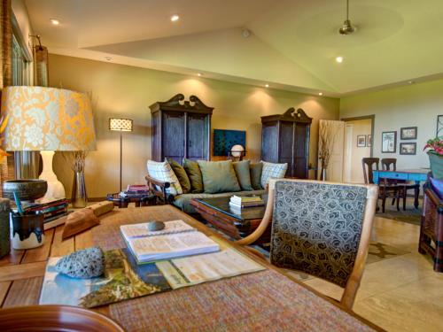 a living room with a couch and a table at Mahana House Country Inn in North Hilo