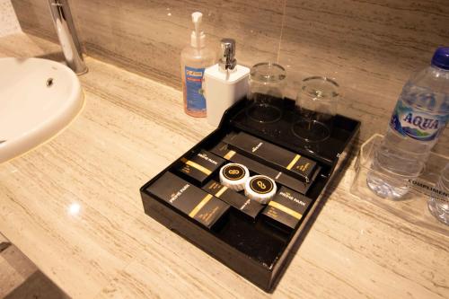 a bathroom with a counter with a sink and a counter at PRIME PARK Hotel & Convention Pekanbaru in Pekanbaru
