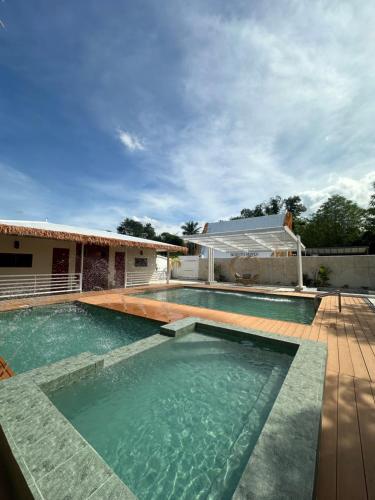 a swimming pool in front of a house at SeventhHeaven Nasugbu in Reparo