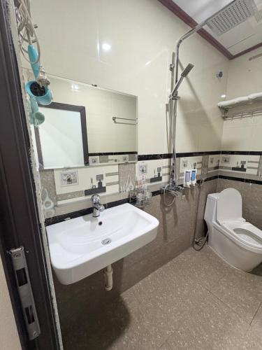a bathroom with a sink and a toilet at Ninh Binh Friendly Hotel in Ninh Binh