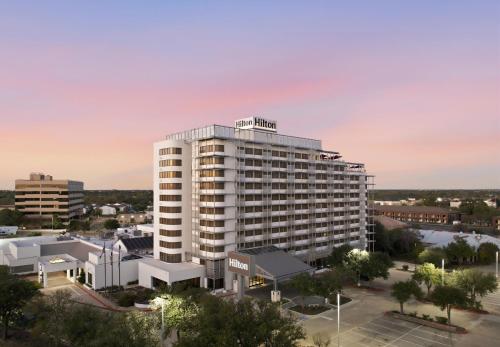 a rendering of a hotel building in a city at Hilton College Station & Conference Center in College Station