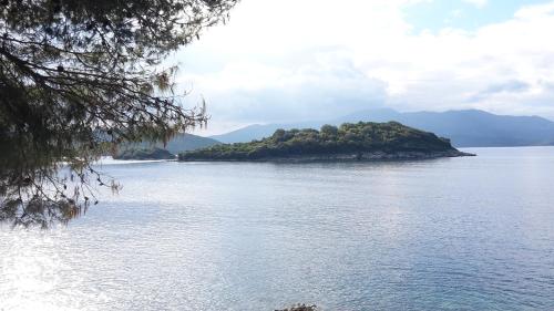 an island in the middle of a large body of water at Vila Bello in Ksamil