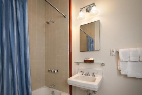 a bathroom with a sink and a shower at Colonial Houses, an official Colonial Williamsburg Hotel in Williamsburg