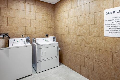 a laundry room with a washer and dryer at Comfort Suites Fishkill near Interstate 84 in Fishkill