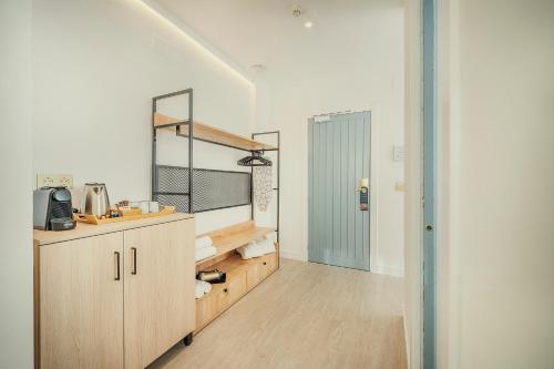 a kitchen with a sink and a counter top at Beneste Nerja Hostal in Nerja