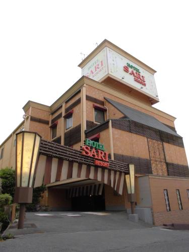 a hotel with a sign that reads horn spa at Sari Resort Kashiba (Adult Only) in Kashiba