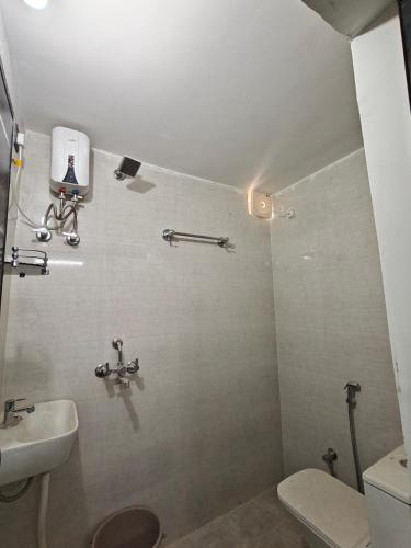 a bathroom with a toilet and a sink at Shivprasad homestay in Varanasi