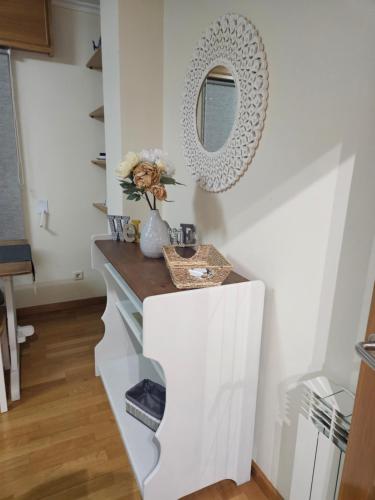 a bathroom with a counter and a mirror on the wall at apartamento castelao in Cedeira