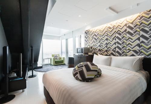 Citadines Fusionopolis Singapore tesisinde bir oda