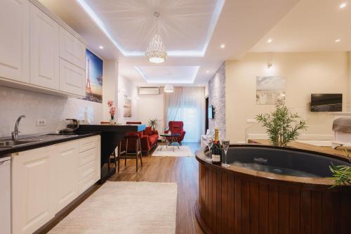 a kitchen with a large island in the middle of a room at Padam Hotel & SPA in Ulcinj