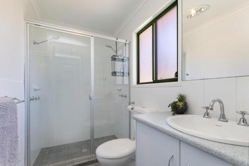 a bathroom with a shower and a toilet and a sink at Viaggio Sul Mare in Baudin Beach
