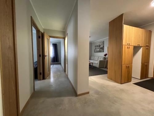 a room with a hallway with a living room at Emmaste Apartment in Emmaste