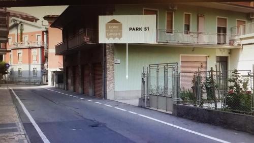 an empty street with a building with a sign that reads park st at - Home Sweet Langhe - Room 51 in Alba