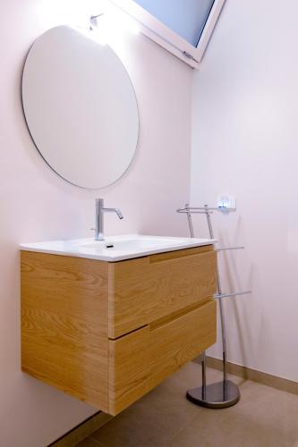 a bathroom with a sink and a mirror at B&B Casa Cappuccini in Tricase
