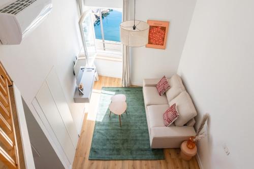 an overhead view of a living room with a couch at Petit Levant in La Ciotat