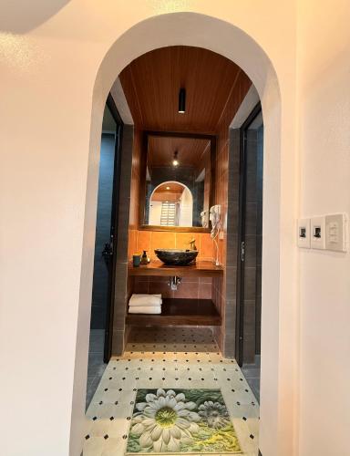 a bathroom with a sink and a mirror at Tam Coc Elegance House in Ninh Binh