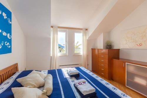 Postel nebo postele na pokoji v ubytování Apartment Hedera A14