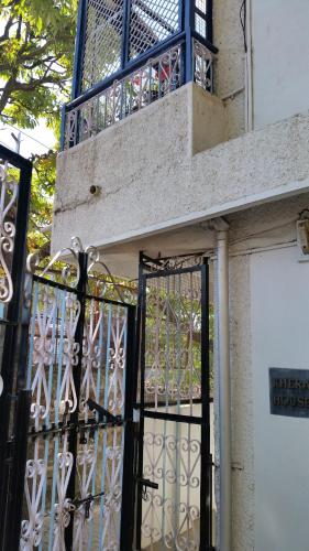 a building with an iron gate and a balcony at Flyer Exotica in Shimla