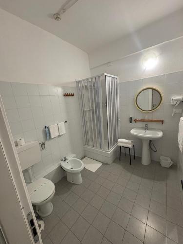 a bathroom with a toilet and a sink and a shower at Hotel Elisabetta in Sestri Levante