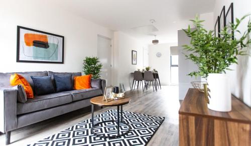 a living room with a couch and a table at The Interchange - 2-Bed - Brand New - Central in Manchester