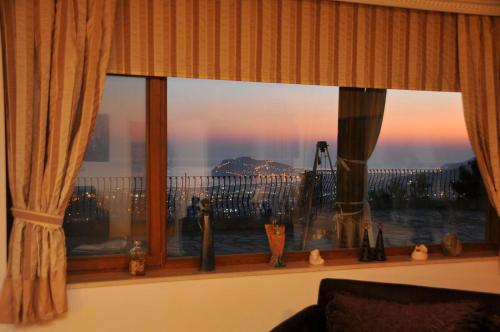 a window with a view of a city at ALANYA KONAKLİ APART in Alanya