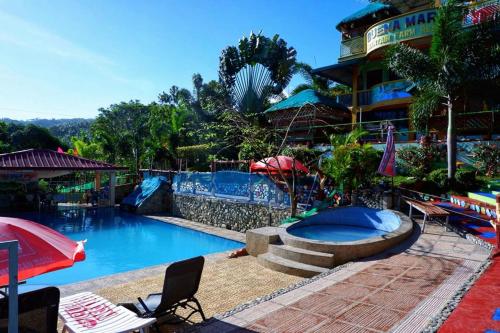 a pool at a hotel with a resort at BuenaMaria Mountain Resort in Puerto Galera
