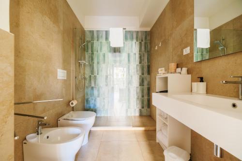 a bathroom with a toilet and a sink at Crystal Camere in Marcelli