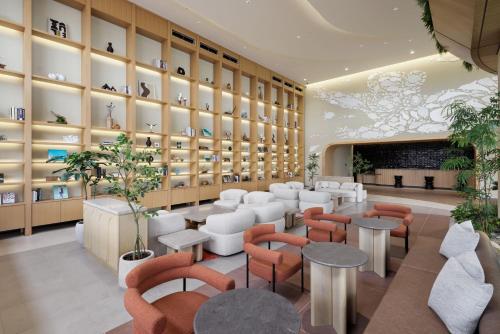 a store with chairs and tables and shelves of vases at Fukuoka Prince Hotel Momochihama in Fukuoka