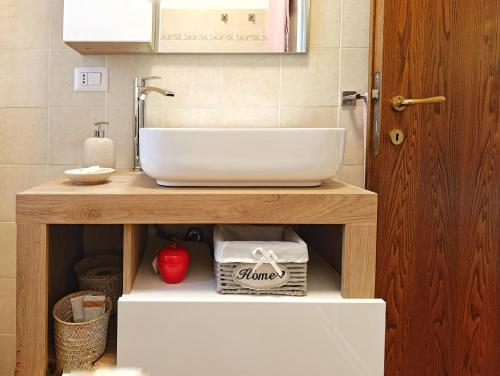 a bathroom with a sink on a wooden table at Il cantuccio di Federico in Radicofani