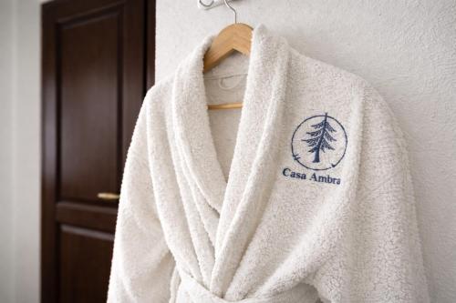 a white towel hanging on a wall at Casa Ambra in Sadova