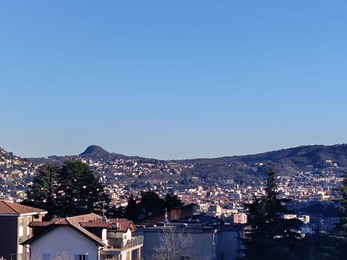 a view of a city with mountains in the background at Elizabeth House in Como