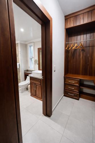 a bathroom with a toilet and a sink at Sol Tropical apartamentos in Punta Cana