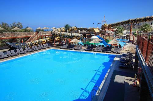 a large swimming pool with a water park at Cactus Fleur Beach in Yalıkavak