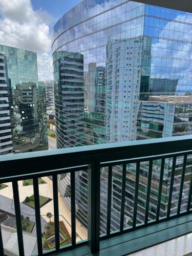 a view of a city from a balcony at Fusion e Vision Flats in Brasília