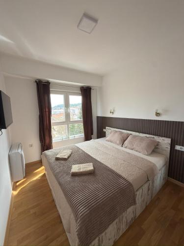 KRUM Apartments tesisinde bir odada yatak veya yataklar