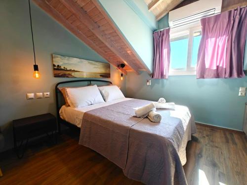 a bedroom with a bed in a room at Aria home in Tsoukalades