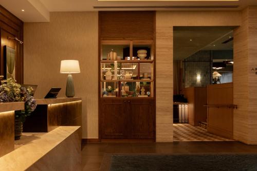 a lobby of a hotel with a reception desk at DoubleTree by Hilton London Victoria in London