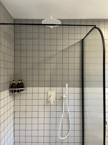 a bathroom with a shower with a shower head at Beach Studio Level - WaveSide Ocean Bliss in Ko Phangan