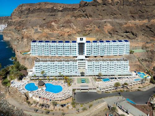 arial view of a hotel with a view of the ocean at Princess Taurito in Taurito