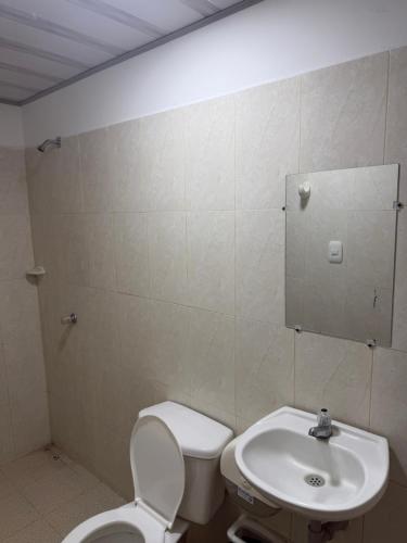 a bathroom with a toilet and a sink at Hotel don Nilo in Albania
