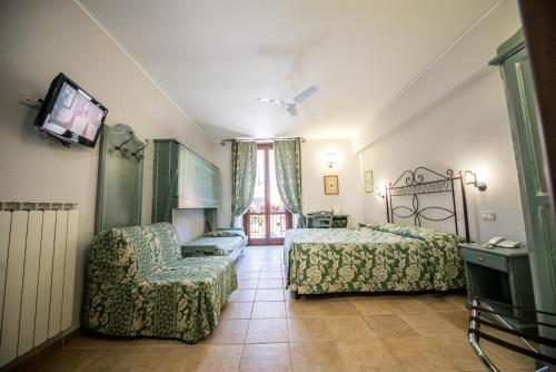 Postel nebo postele na pokoji v ubytování Hotel Il Tiglio