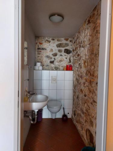 a bathroom with a sink and a toilet at Barthmühle in Klipphausen