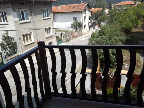 a balcony with a view of a street and buildings at Family Hotel Miglena in Govedartsi