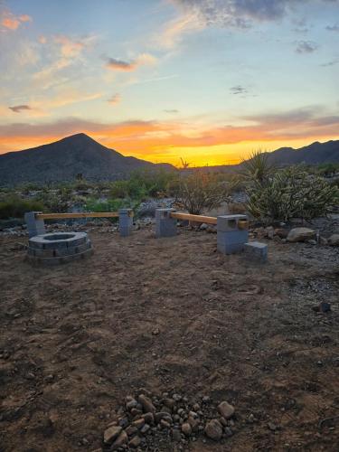 a view of a sunset with a mountain in the background at Star Gazer #3 Glamping in Meadview