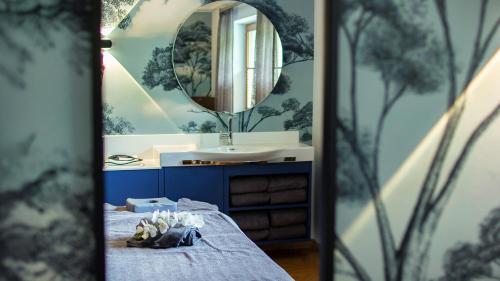a bathroom with a sink and a mirror at Hotel Magdalena im Zillertal - Urlaub mit Hund in Ried im Zillertal