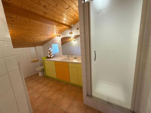 a bathroom with a sink and a mirror at Gîte Le 1935 Évasion en Ardèche, au cœur de la campagne, idéal pour balades à vélo et moto in Saint-Sylvestre