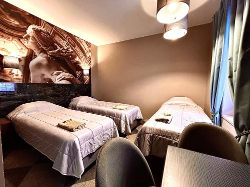 a hospital room with two beds and a tv at Best apartments Narva in Narva