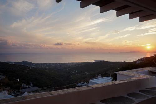 a view of the ocean at sunset from a building at The Artist House in Triandáros